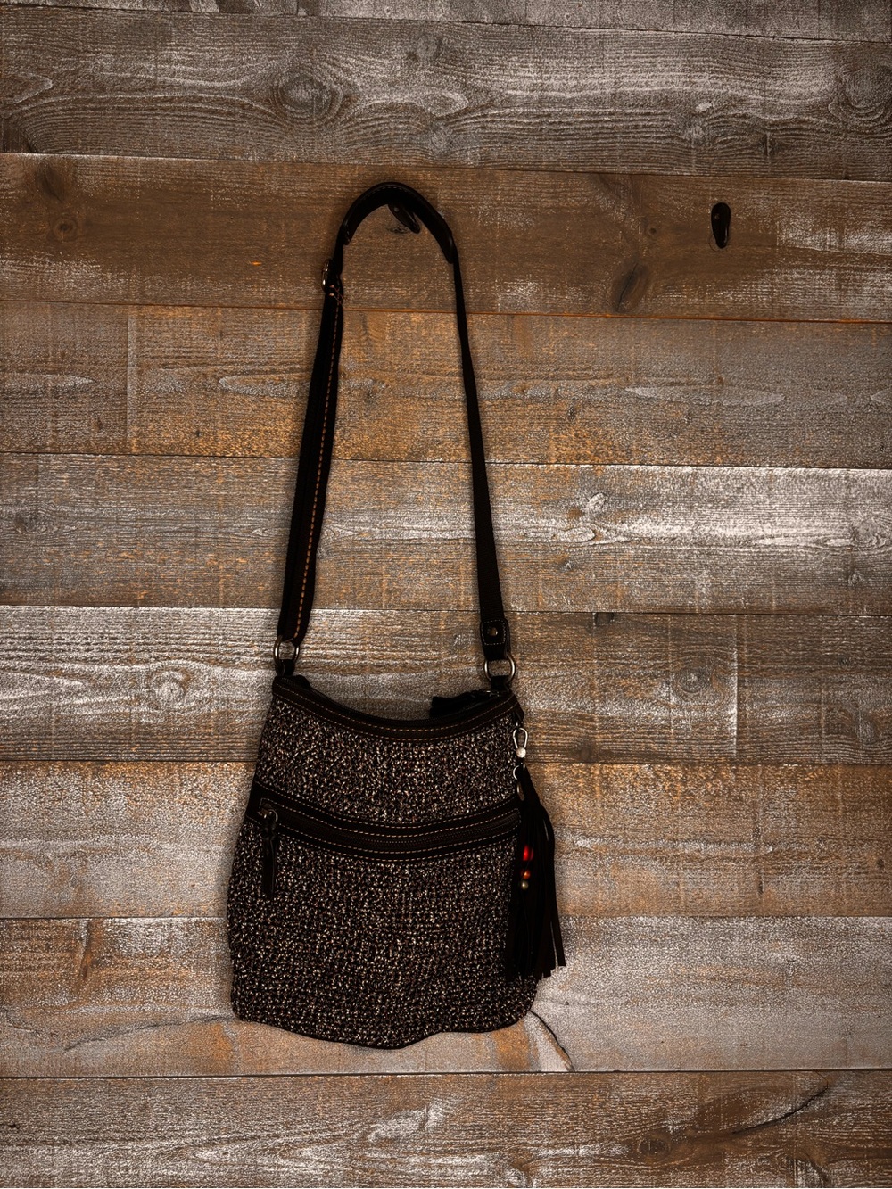 The Sak Urban Static Woven Crossbody Bag with Tassel Accent - Black grey